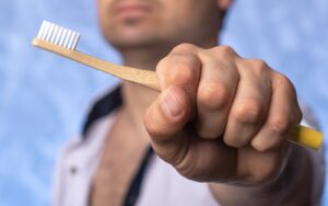 Man Holding Tooth Brush